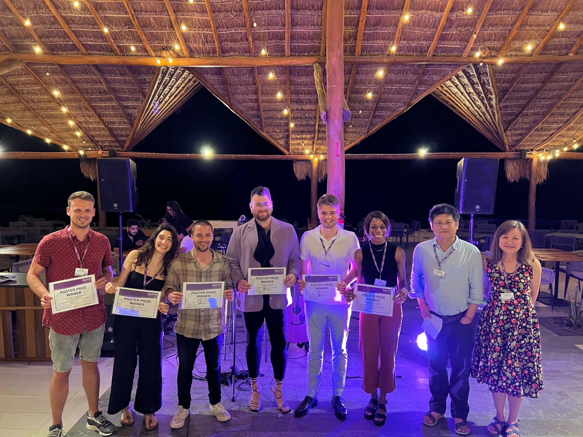 Tim and Luca winning poster prizes at Fusion 2022